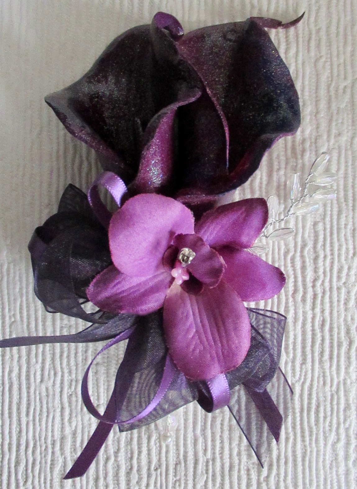 Plum pearlised Calla Lily Corsage